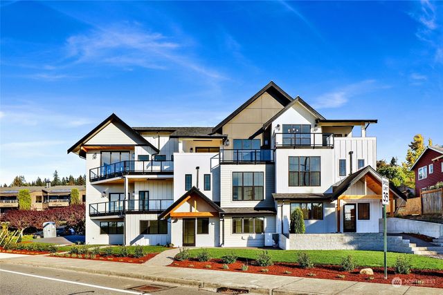 a front view of a residential houses with city street