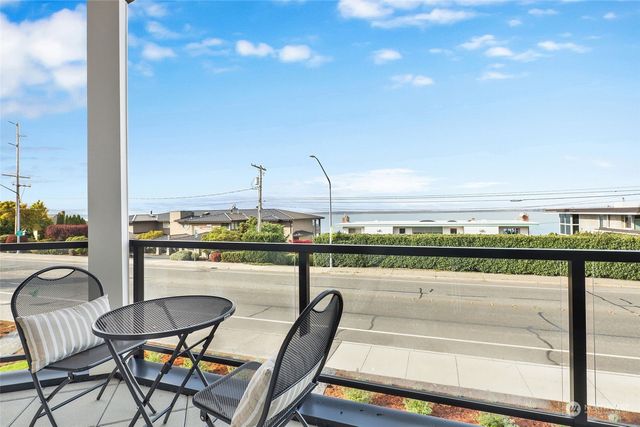a kitchen with a stove top oven sink and window
