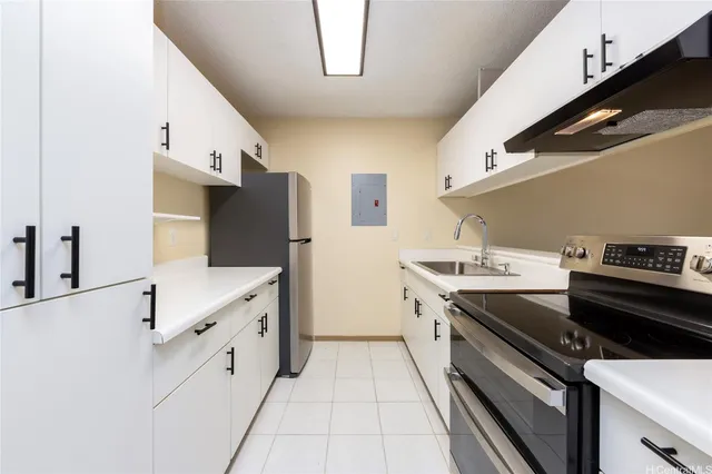 a kitchen with stainless steel appliances a stove and a refrigerator