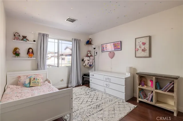 a bedroom with a bed and cabinets