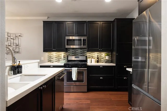 a kitchen with a sink stove and microwave