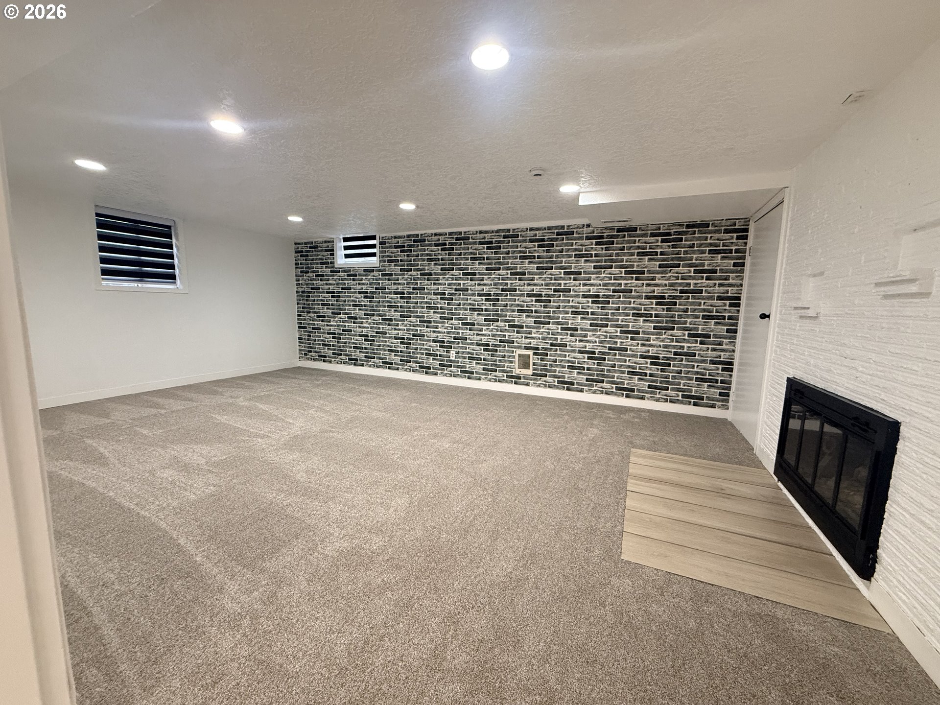 2126 Lewis River Road Woodland, WA 98674 - Photo 24 of 27 a view of an empty room with a fireplace