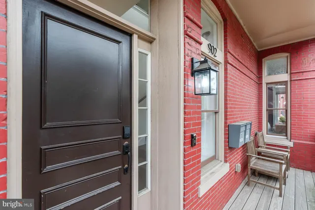 a view of front door of house with stairs