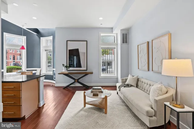 a living room with furniture and a large window