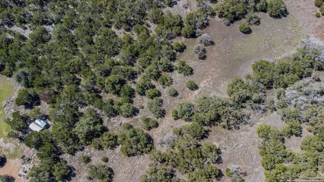 an aerial view of house with yard