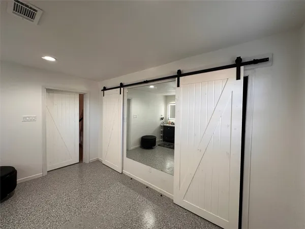 a bathroom with a glass shower door