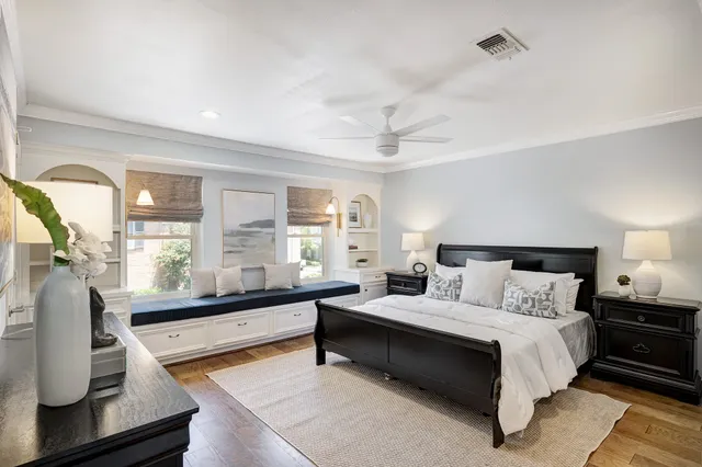 a large bedroom with a bed and a couch