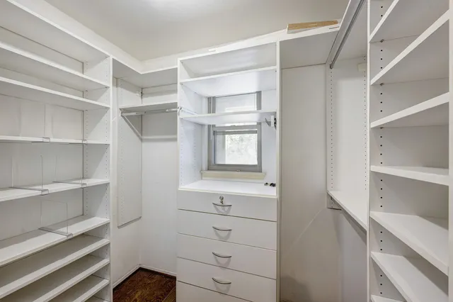 a view of an empty walk in closet