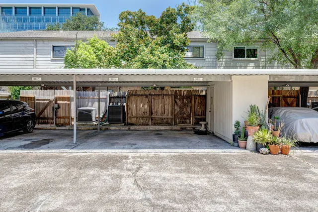 a view of a chairs and table in the patio