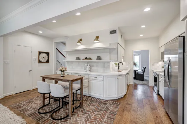 a kitchen with sink cabinets and stainless steel appliances