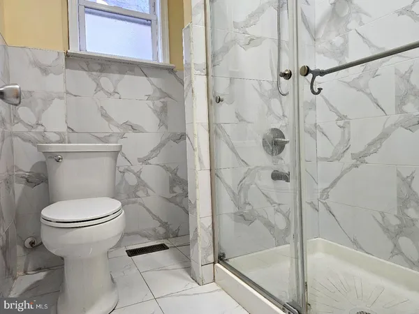 a bathroom with a sink and a window