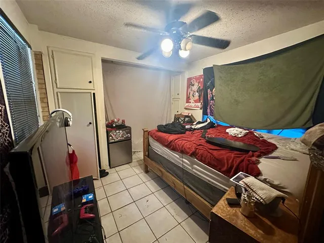 a bedroom with furniture and a window