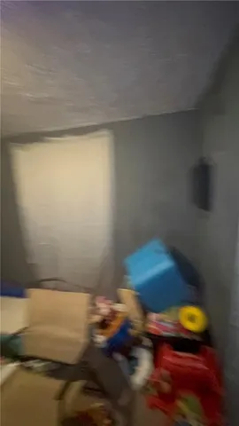 a backyard of a house with wooden fence and trees