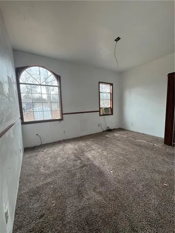 a front view of a house with parking space