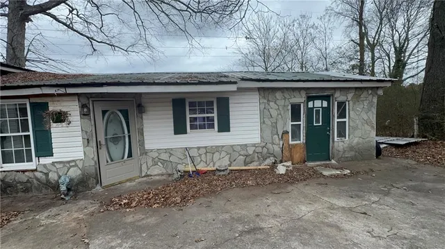a bedroom with a bed and a mirror
