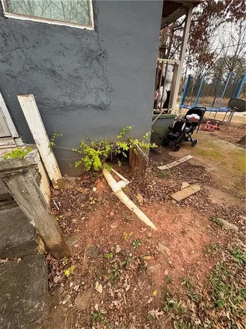 a view of cars parked in a yard of a house