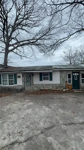 a bathroom with a sink toilet and mirror