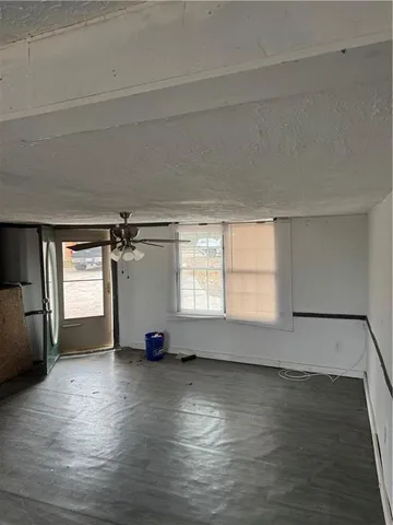 a bathroom with a toilet and a mirror