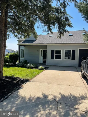 a front view of a house with yard