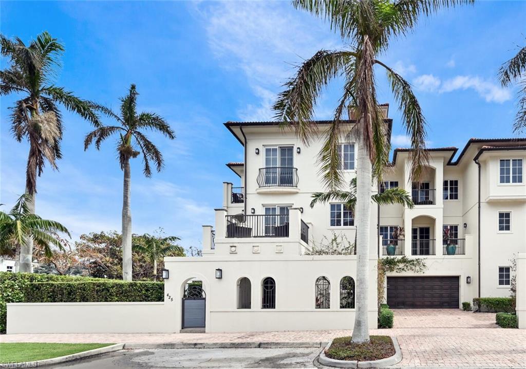 425 5th Street South, Unit A Naples, FL 34102 - Photo 1 of 44 a front view of a building with palm trees