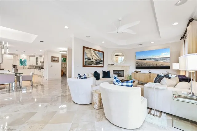 a living room with fireplace furniture and a flat screen tv