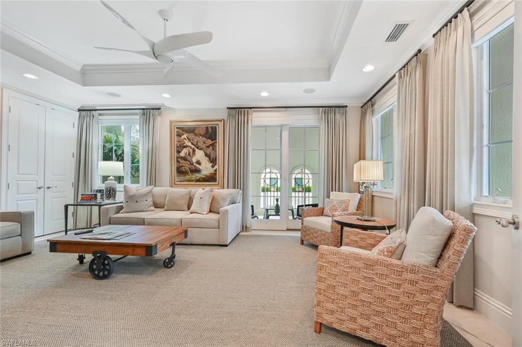 425 5th Street South, Unit A Naples, FL 34102 - Photo 15 of 44 a living room with furniture and a large window