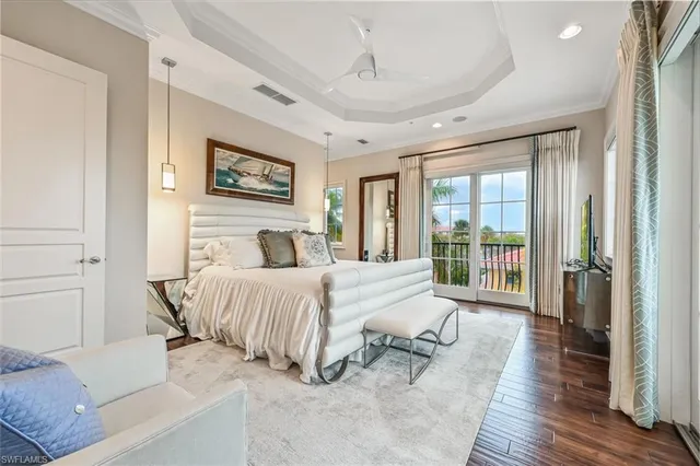 a spacious bedroom with a large bed and a large window