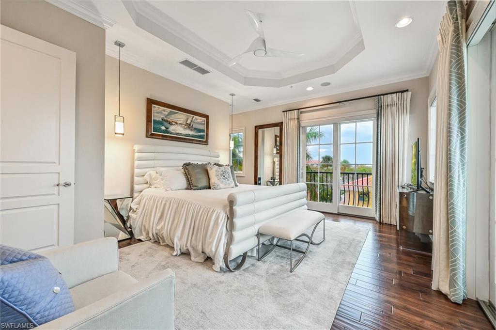 425 5th Street South, Unit A Naples, FL 34102 - Photo 21 of 44 a bedroom with a bed and a large window