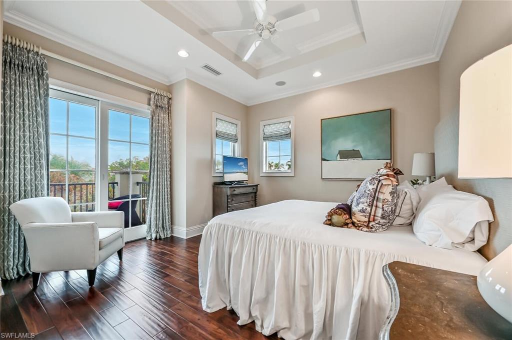 425 5th Street South, Unit A Naples, FL 34102 - Photo 26 of 44 a bedroom with furniture and a large window