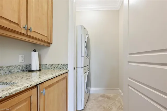 a bathroom with a granite countertop toilet a sink and a mirror