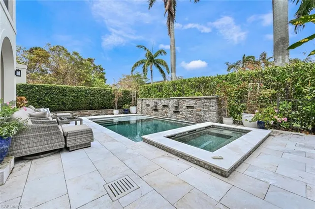 a view of swimming pool with outdoor seating