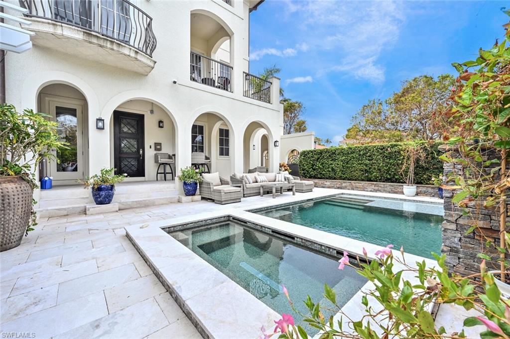 425 5th Street South, Unit A Naples, FL 34102 - Photo 34 of 44 a view of swimming pool with outdoor seating