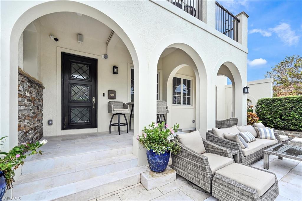 425 5th Street South, Unit A Naples, FL 34102 - Photo 37 of 44 a front view of a house with entryway