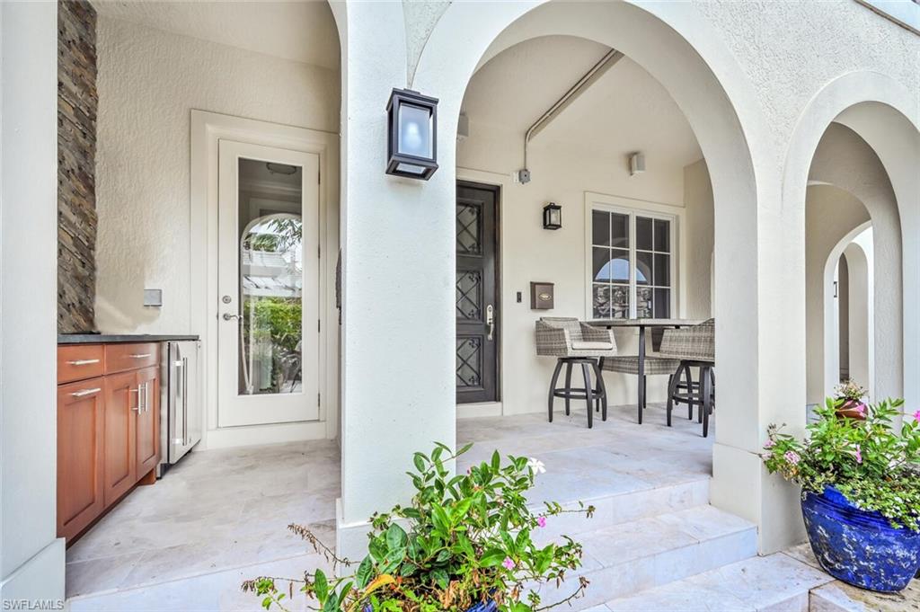 425 5th Street South, Unit A Naples, FL 34102 - Photo 39 of 44 a view of a entryway door front of house