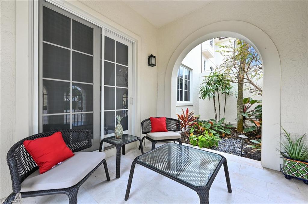 425 5th Street South, Unit A Naples, FL 34102 - Photo 42 of 44 a living room with furniture and a potted plant