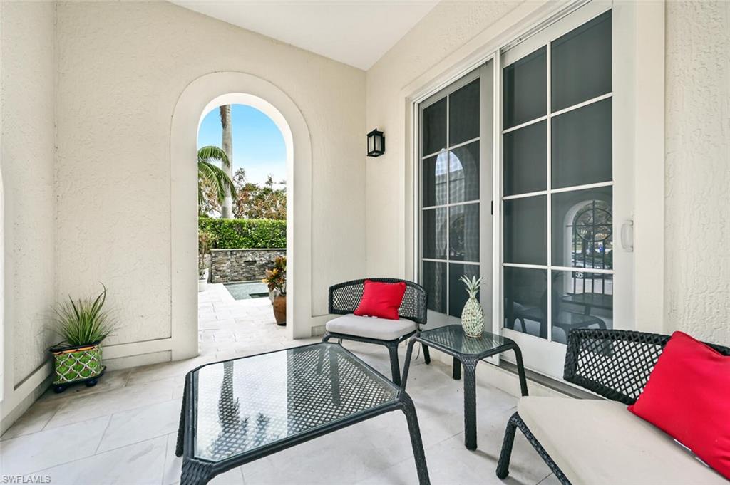 425 5th Street South, Unit A Naples, FL 34102 - Photo 43 of 44 a living room with furniture and a potted plant