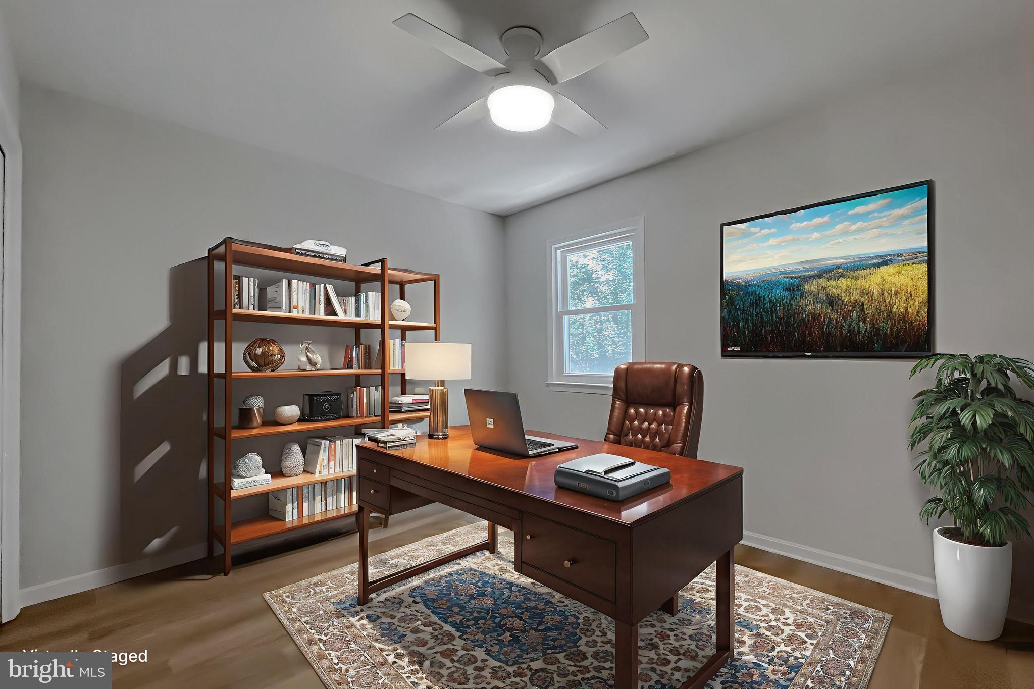 22373 Enoch Road Leonardtown, MD 20650 - Photo 54 of 74 a living room with furniture a bookshelf and a window