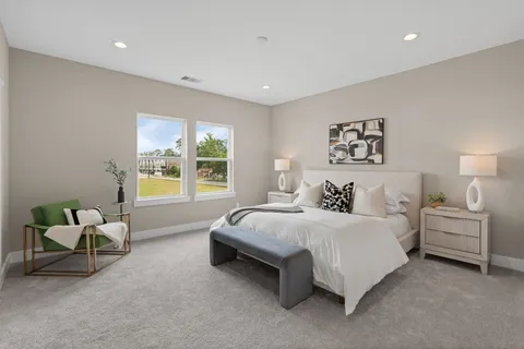 a bedroom with a bed and a painting