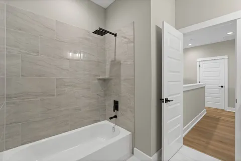 a view of an house with backyard and porch