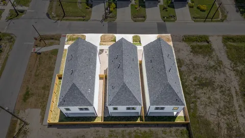 a aerial view of a house with a big yard