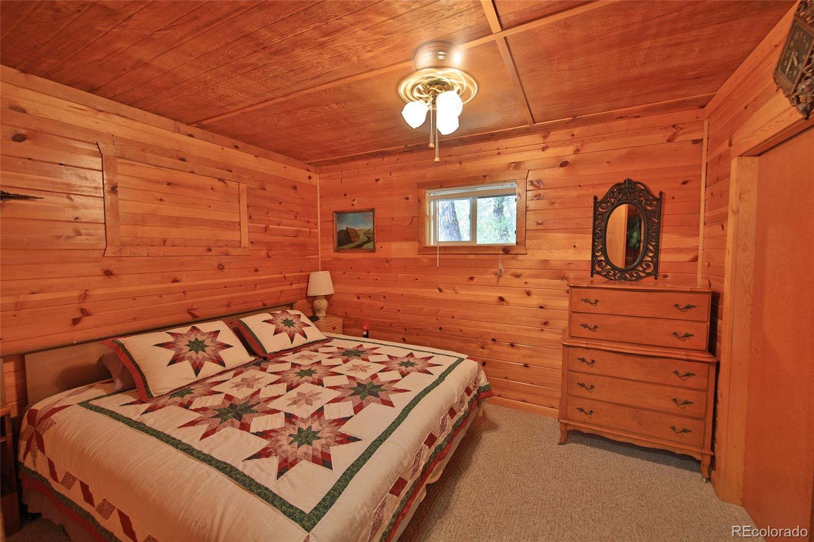 9681-56 56 2/10 Road Molina, CO 81646 - Photo 15 of 39 a bedroom with a bed and a dresser