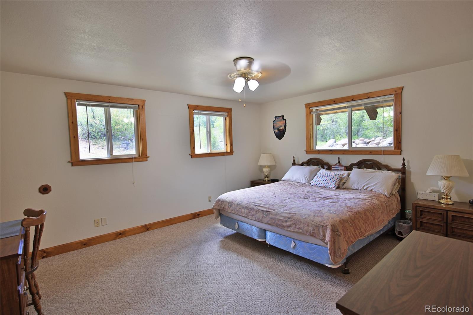 9681-56 56 2/10 Road Molina, CO 81646 - Photo 18 of 39 a bedroom with a bed chandelier and a window