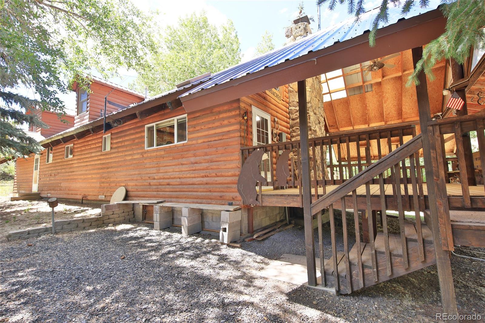 9681-56 56 2/10 Road Molina, CO 81646 - Photo 26 of 39 a view of a house with a yard