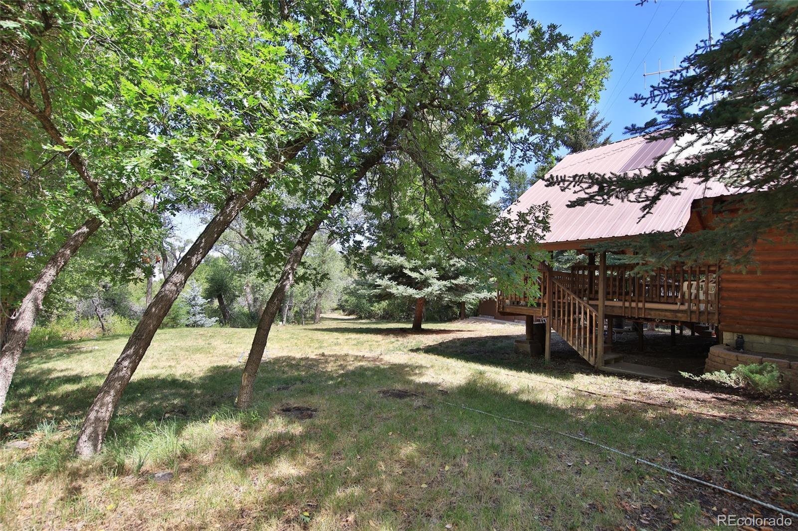 9681-56 56 2/10 Road Molina, CO 81646 - Photo 28 of 39 a view of a backyard with a tree