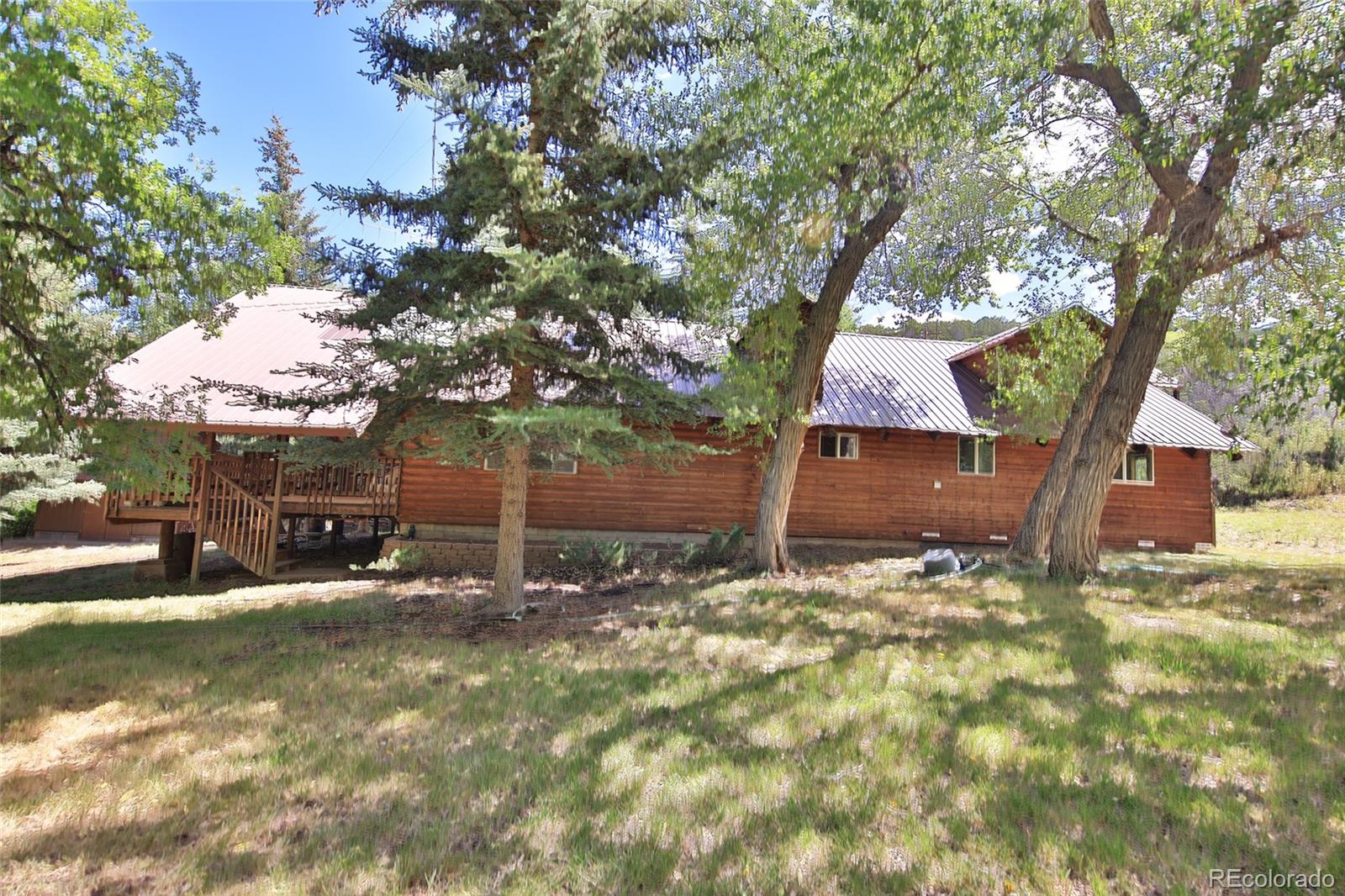 9681-56 56 2/10 Road Molina, CO 81646 - Photo 29 of 39 a backyard of a house with table and chairs