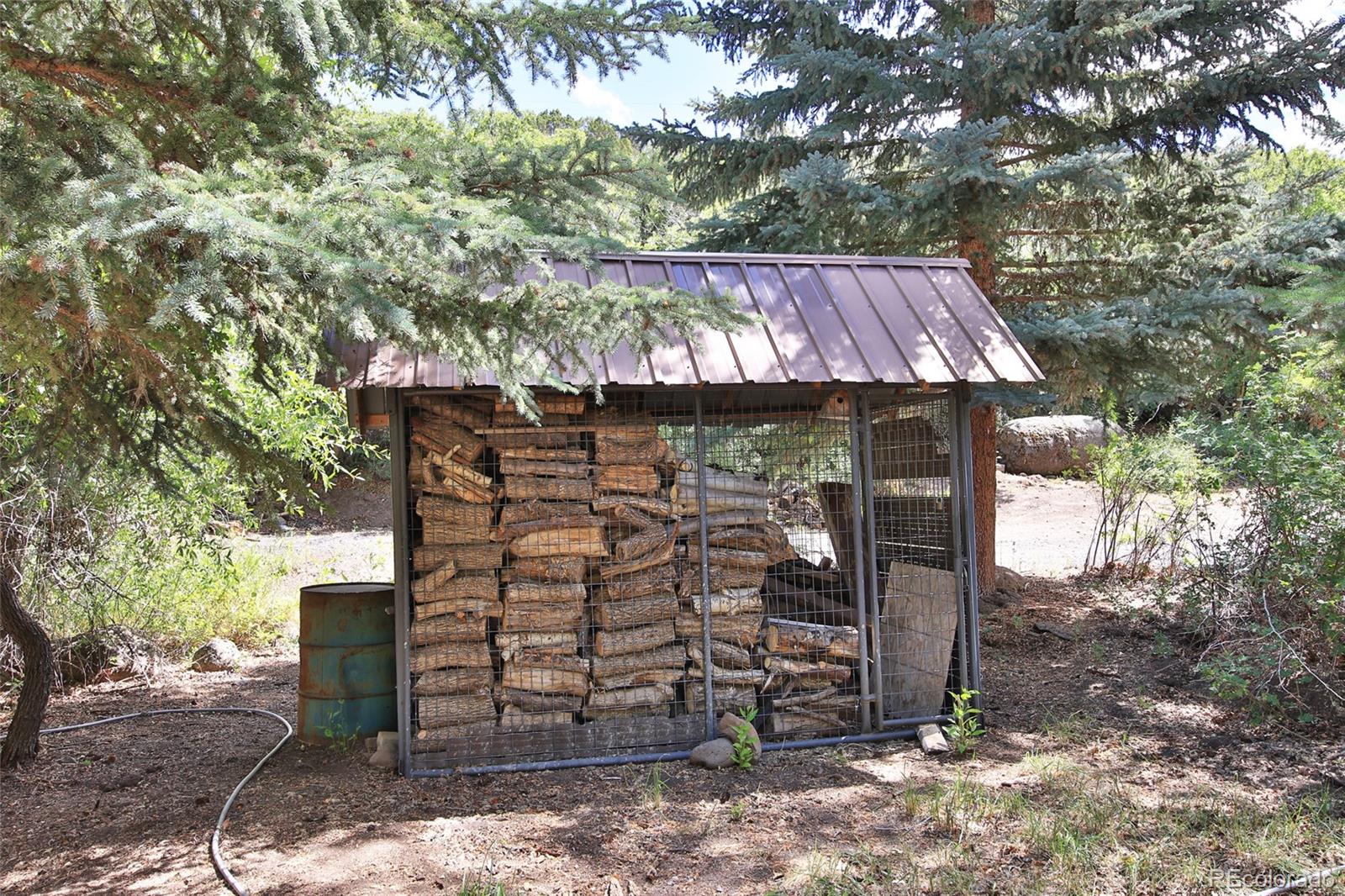 9681-56 56 2/10 Road Molina, CO 81646 - Photo 33 of 39 a view of a wooden house with a trees