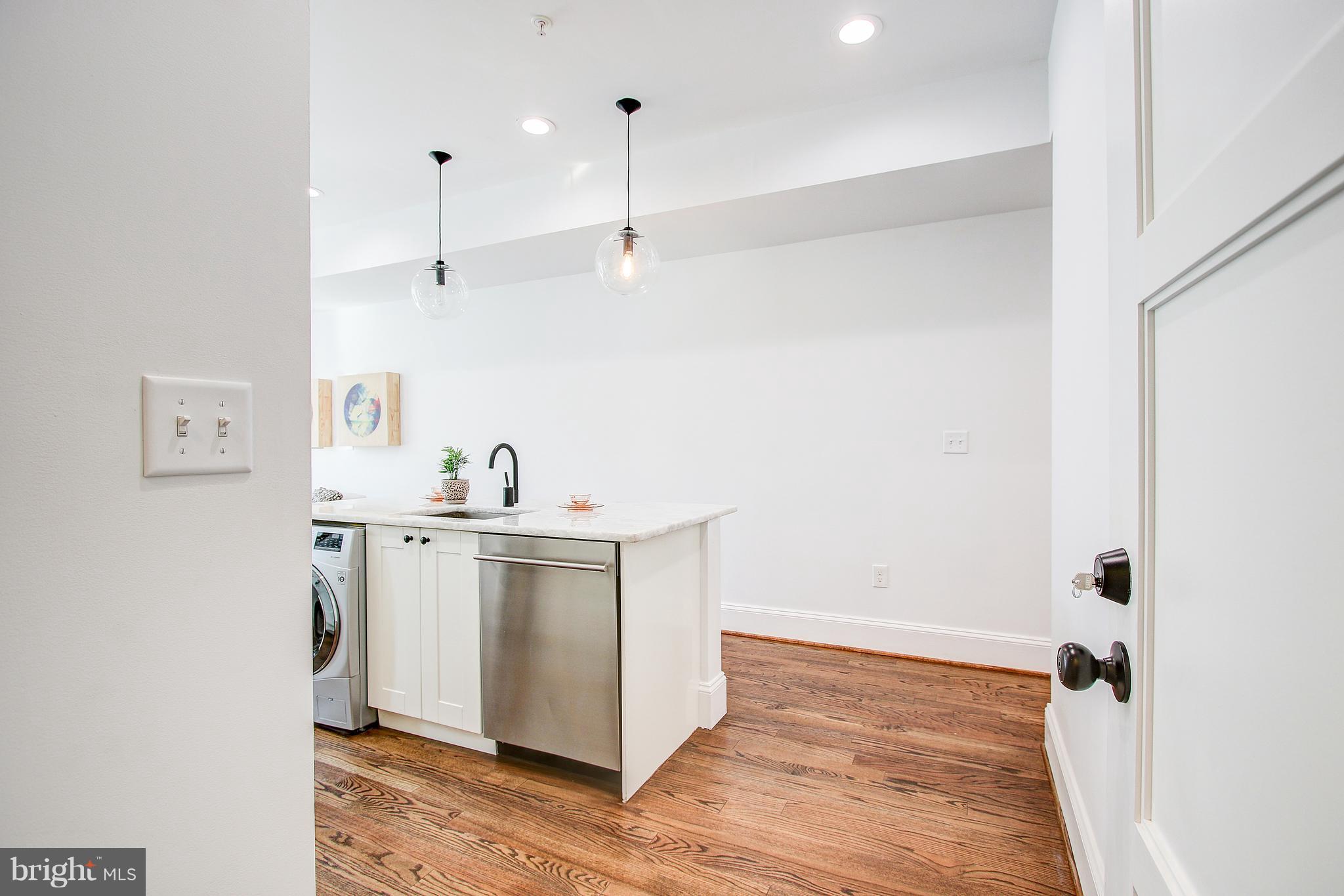 1723 U Street Northwest, Unit 3 Washington, DC 20009 - Photo 2 of 28 a view of cabinets and wooden floor