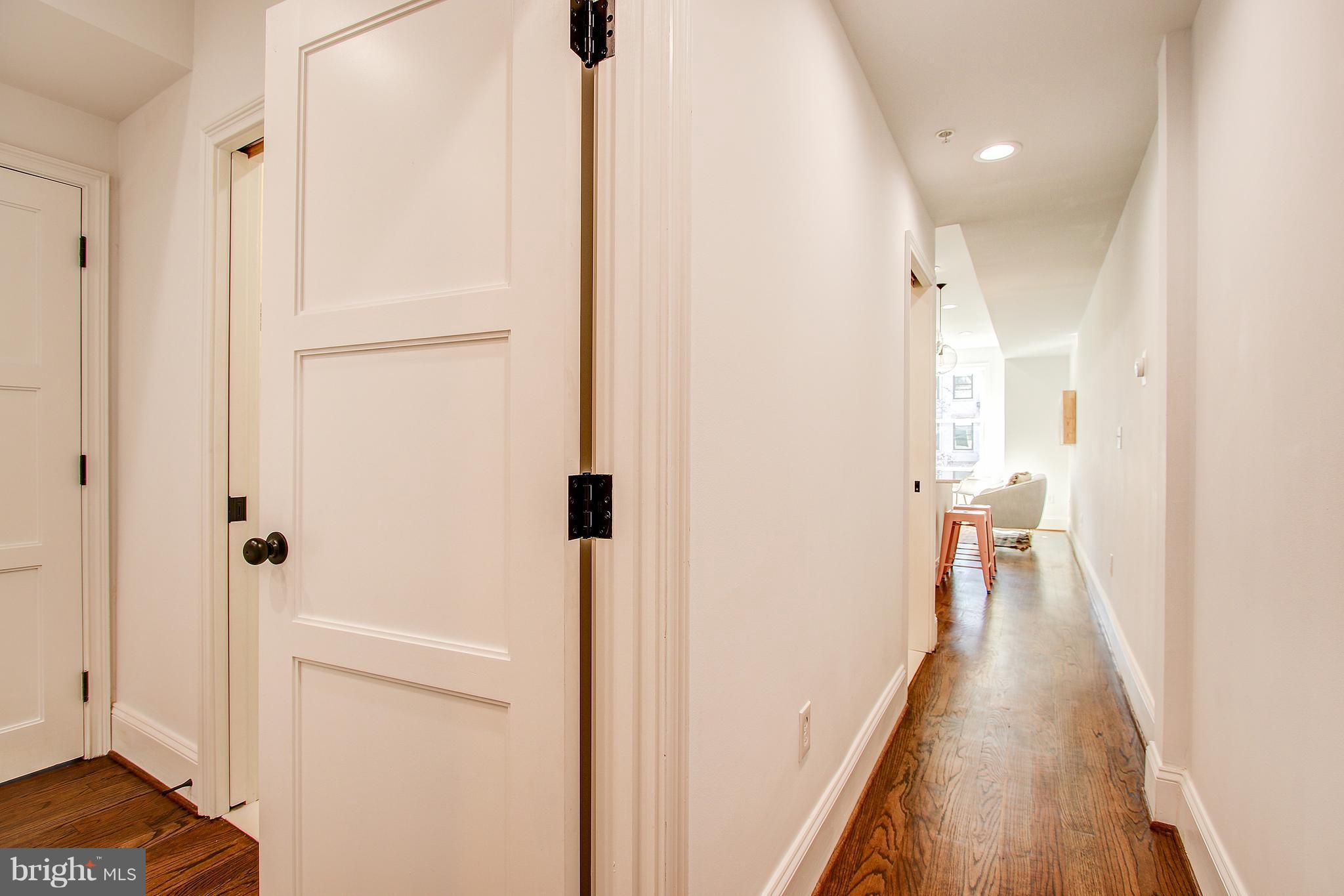 1723 U Street Northwest, Unit 3 Washington, DC 20009 - Photo 15 of 28 a view of a hallway with wooden floor and staircase