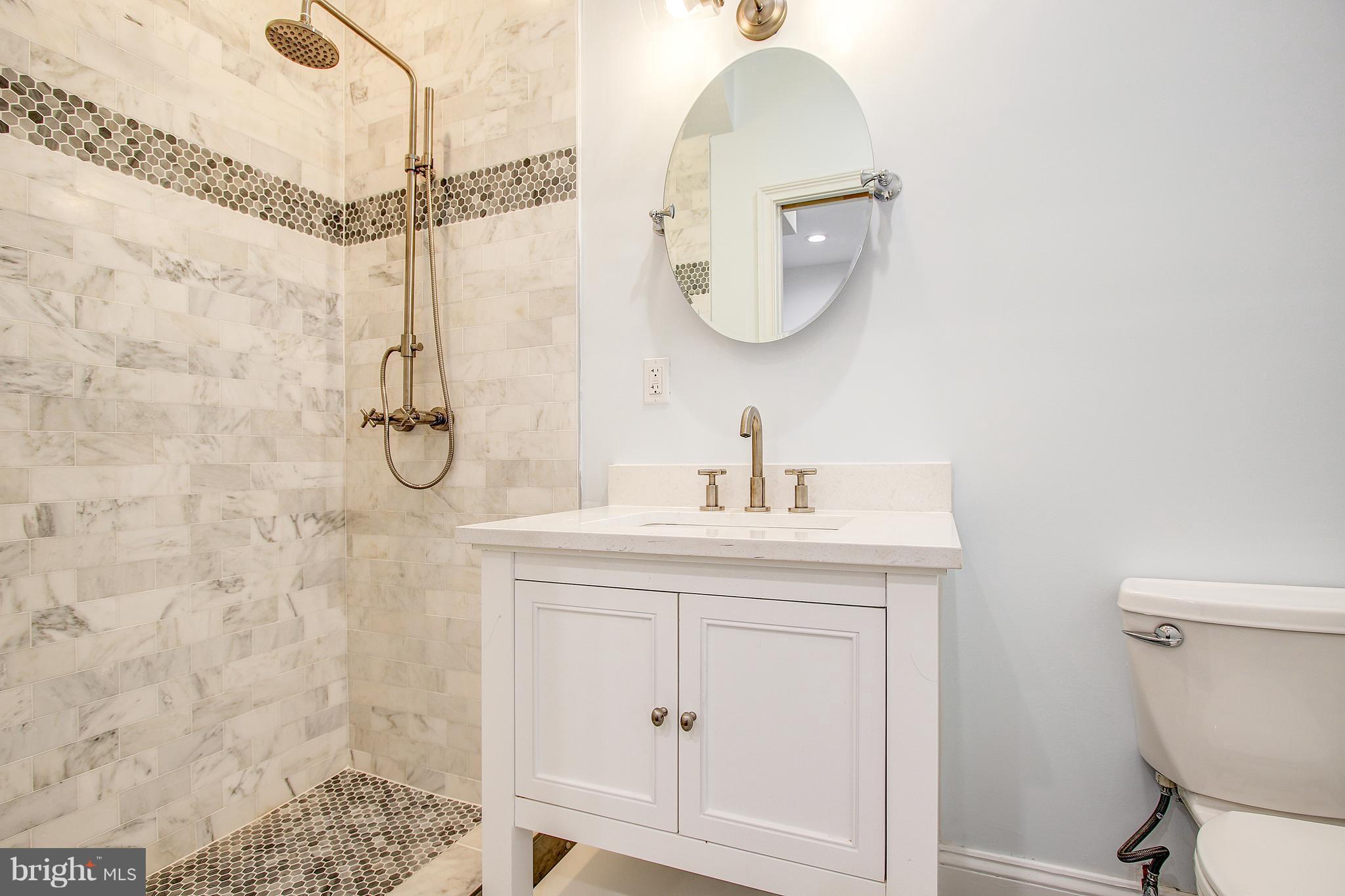 1723 U Street Northwest, Unit 3 Washington, DC 20009 - Photo 17 of 28 a bathroom with a sink a toilet and shower