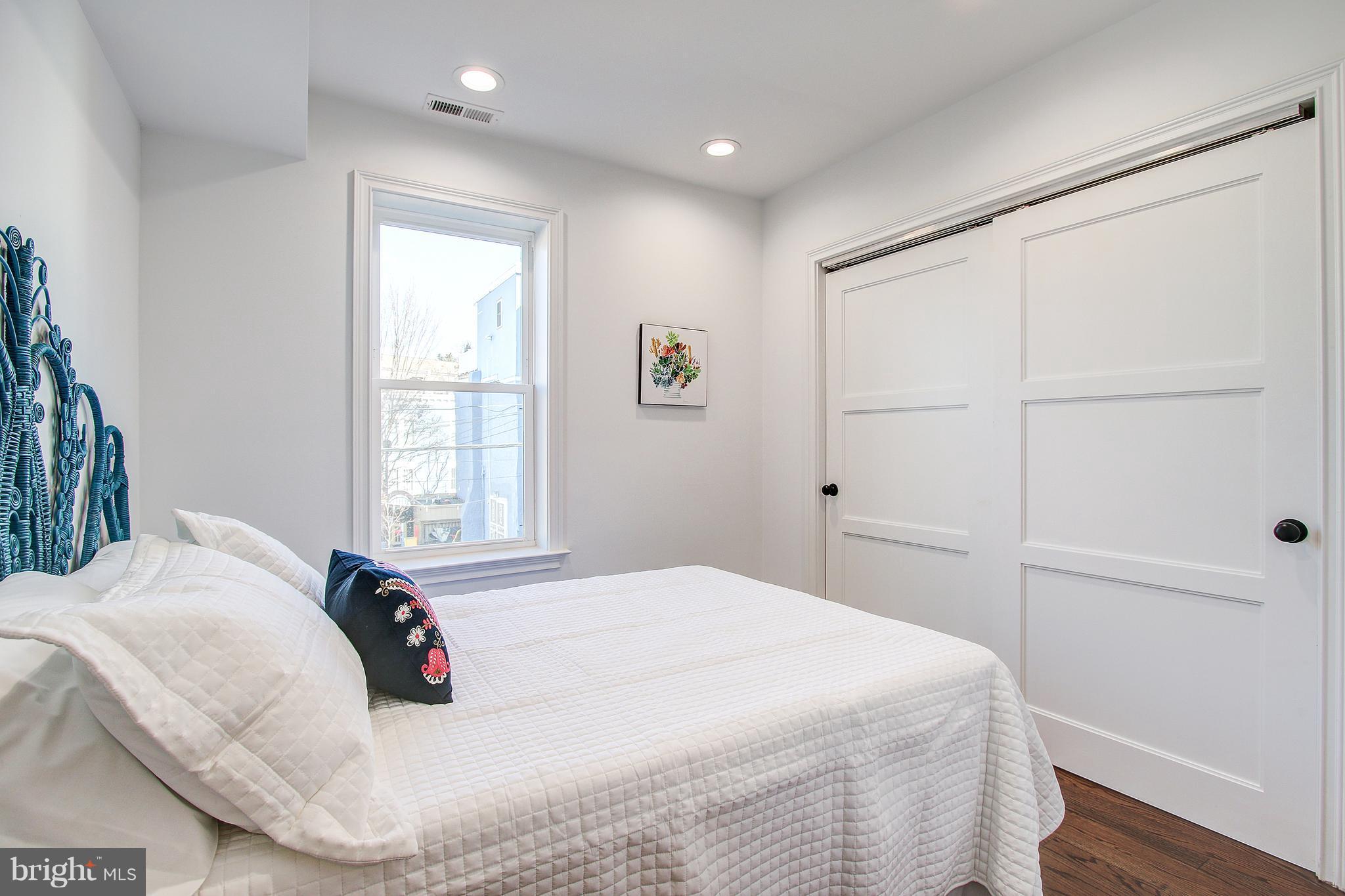 1723 U Street Northwest, Unit 3 Washington, DC 20009 - Photo 18 of 28 a bedroom with a bed and a window